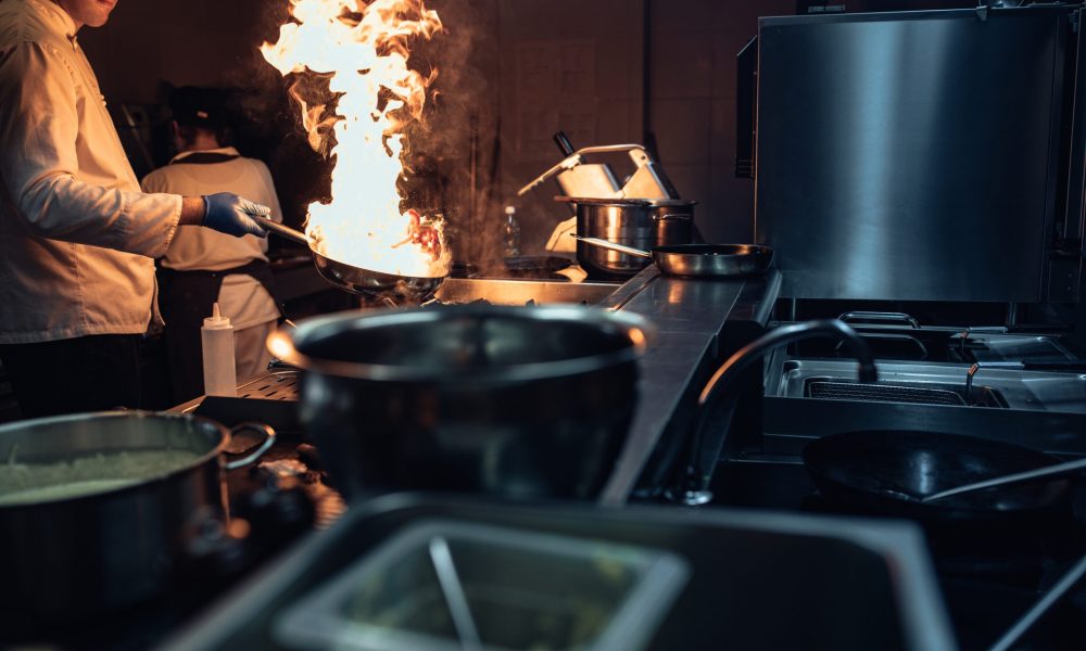 Cropped shot of a chef cooking in a professional kitchen